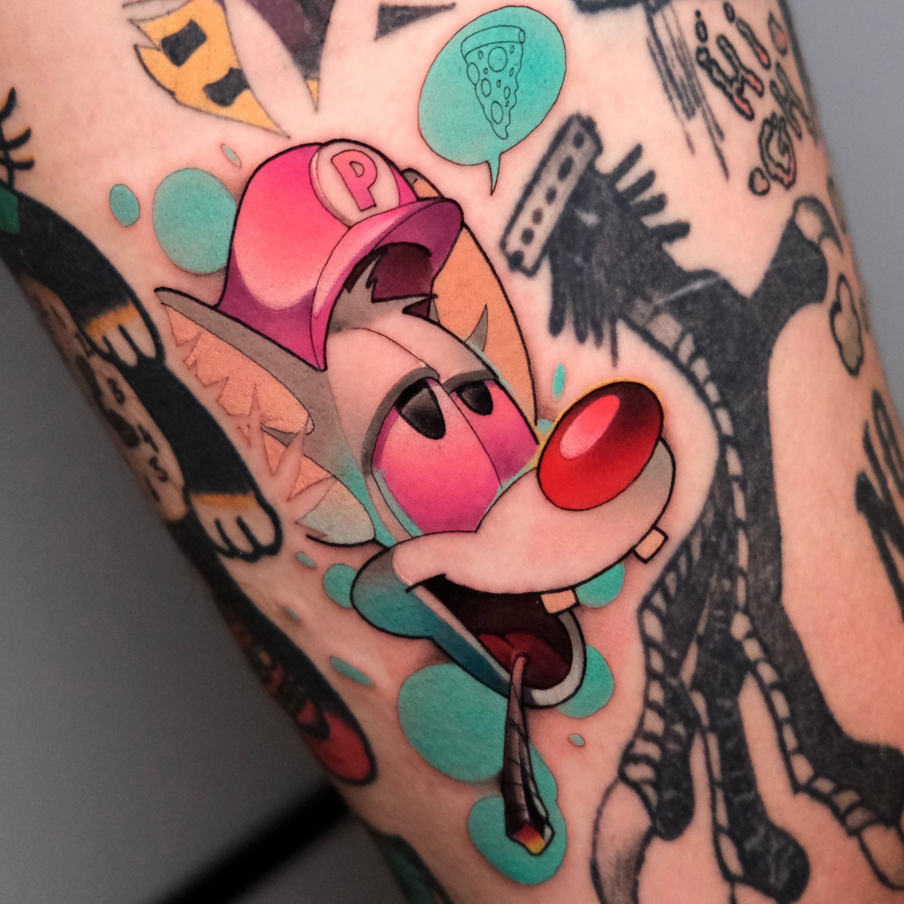 Color cartoon tattoo by Sasha Akulov, custom tattoo artist in Espoo